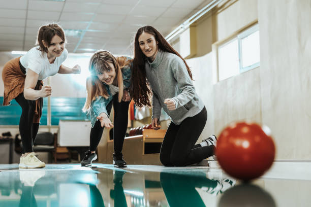 istock Three Female Friends Bowling Together 1487412113