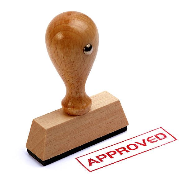 istock Wooden rubber stamp written approved 148741223