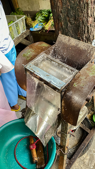 A coconut grated machine used by market traders to grate coconut