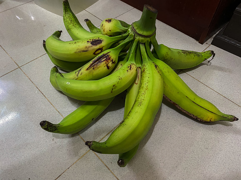 unripe banana with a very large size