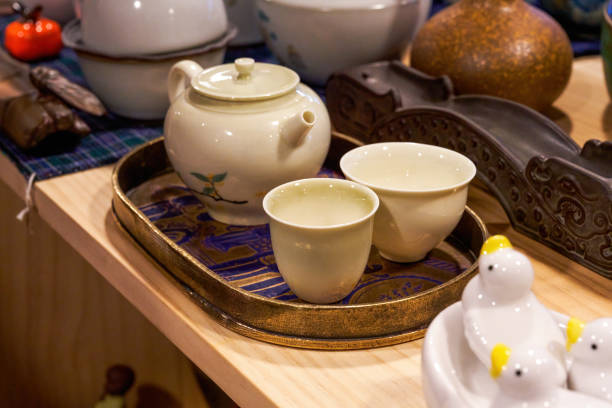 istock Close-up of various Chinese tea sets on shelves 1487415826