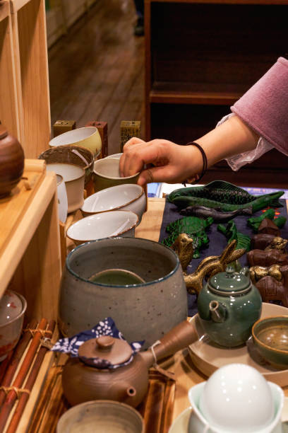 istock Close-up of various Chinese tea sets on shelves 1487415845