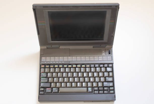 istock floppy disks and old laptop on a white background 1487415996