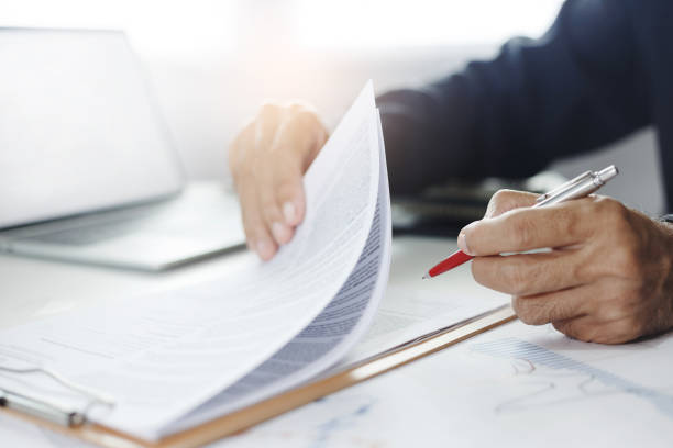 istock business person working on desk 1487417115