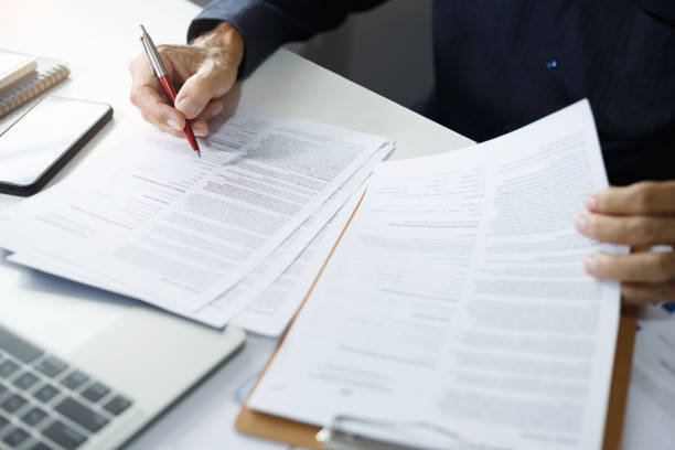 istock business person working on desk 1487417116