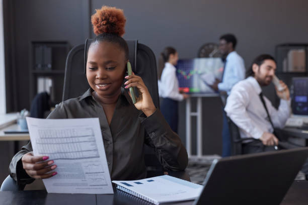 istock Trader discussing financial market with customer 1487420435