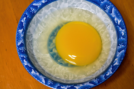 Close-up of an opened goose egg yolk protein