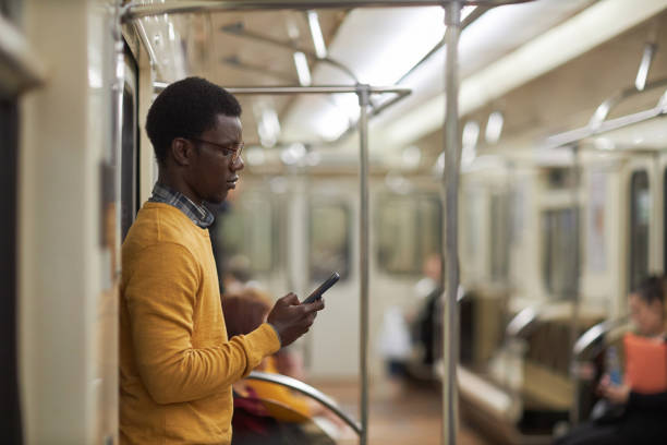 istock Man reading online in subway car 1487423765