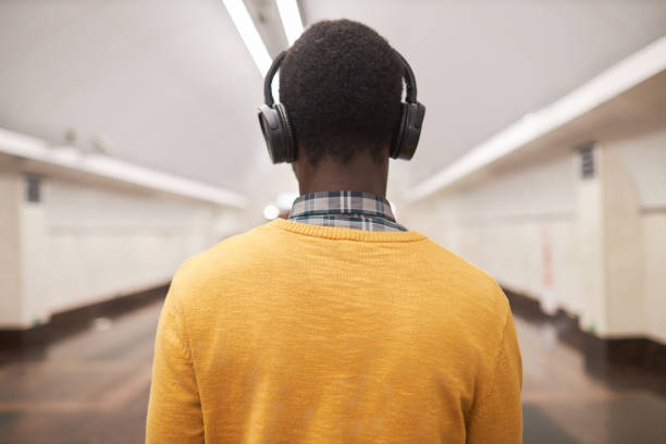 istock Man in headphones standing in underground 1487423776