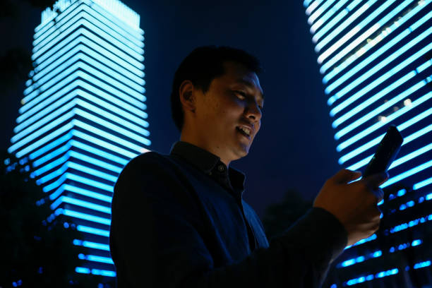 Young Asian businessmen are using smartphones
