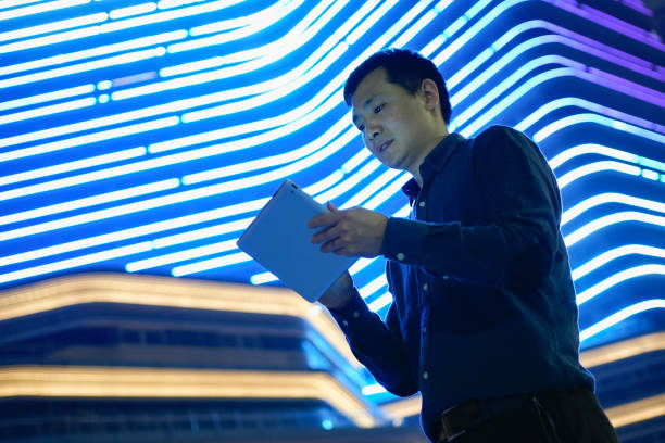 istock The businessman is using a tablet computer outside in a bright light 1487428273