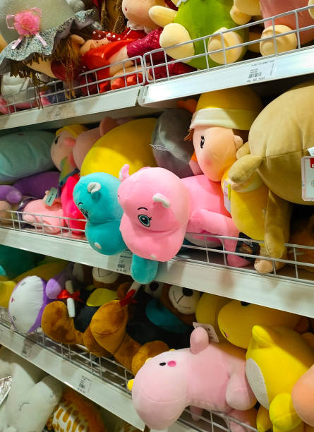 istock Colorful Dolls Neatly Arranged on a Shelf 1487429916