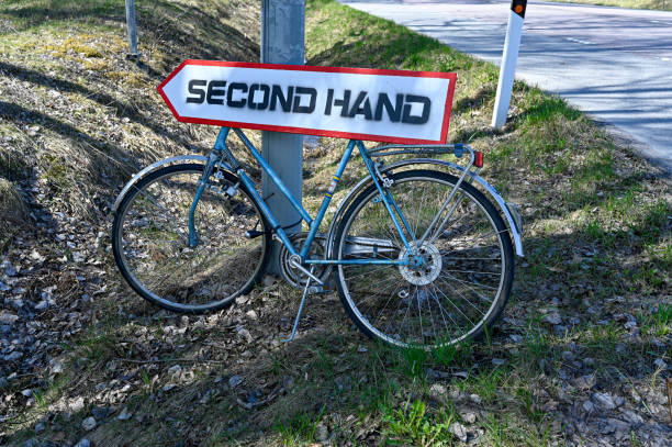 Sign and arrow to a second hand shop Kumla Sweden may 3 2023