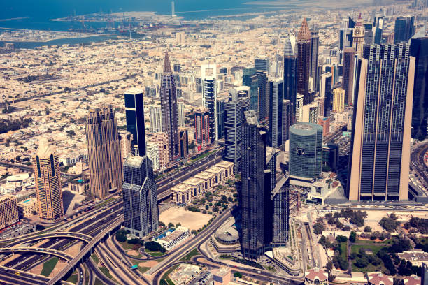 istock Dubai skyline on sunset, modern city with skyscrapers 1487434076