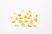 Chopped pistachios on white background
