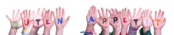 Children Hands Building Word Guten Appetit, Isolated Background stock photo