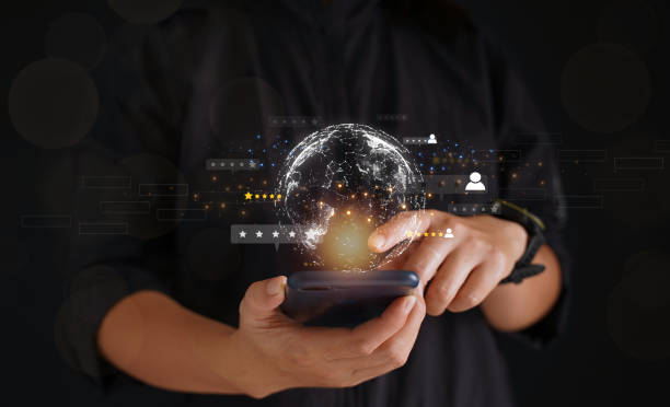 istock Businessman in a black suit using a chatbot on an AI smartphone. GPT chat, chatting with AI artificial intelligence on data screen and data linking and perception with satisfaction service. 1487437220