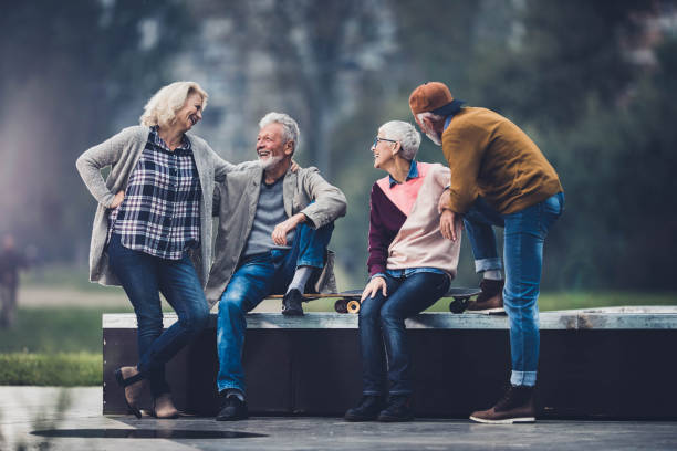istock Happy senior couples talking while spending a day in the park. 1487439039
