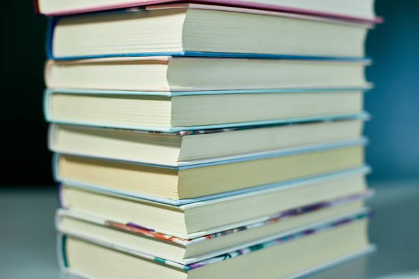 istock Stack of books on dark backgrounds, World book day 1487440728