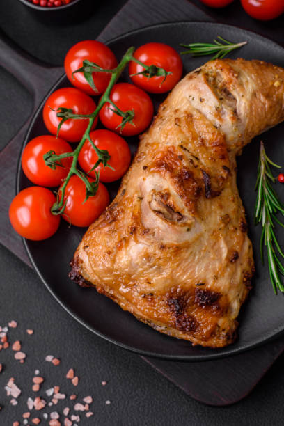 istock Fresh grilled chicken leg with salt, spices and herbs 1487441620