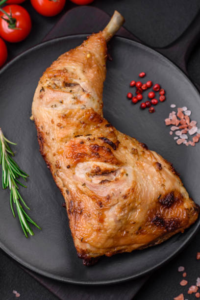 istock Fresh grilled chicken leg with salt, spices and herbs 1487442056