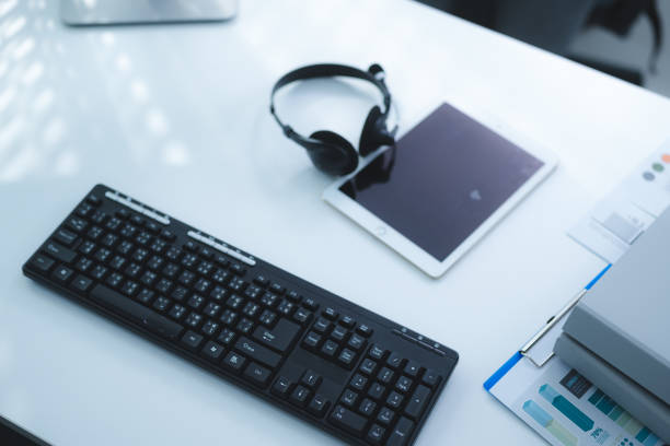 istock work desk with laptop and documents, books, modern interior of cozy cabinet, table for businessman or student at home, comfortable workspace, workplace with computer in apartment Keywords: 1487442116