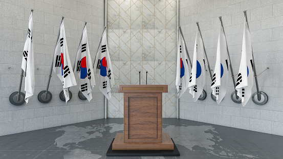 South Korea Parliament Concept Korean Flag in a Row with a Empty Wooden Wall. Press Conference in Government Building. 3D Render