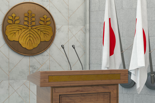 Japan Parliament Concept Japanese Flag in a Row with a Empty Wooden Wall. Press Conference in Government Building. 3D Render