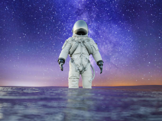 istock Astronaut Standing in Liquid Ocean Surface in a Overcast Alien Environment with Starry Space 1487450265