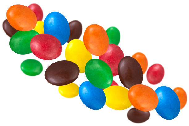 istock Levitation of multicolored glazed dragee isolated on white background. 1487451858