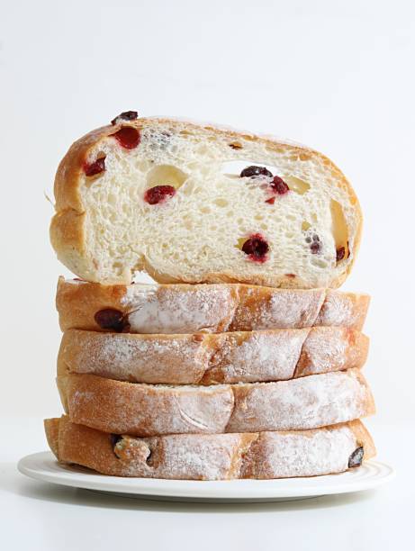 Sliced white bread arrangement, stacked bread slices on wooden background, freshly sliced bakery bread image stock photo
