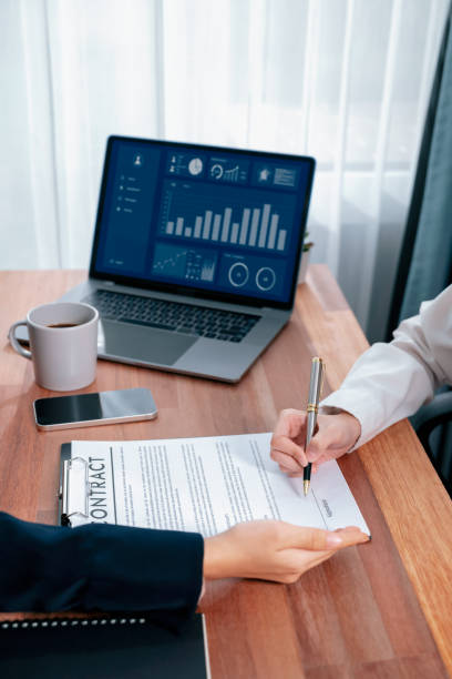istock Closeup hand signing contract document with pen. Enthusiastic. 1487453580