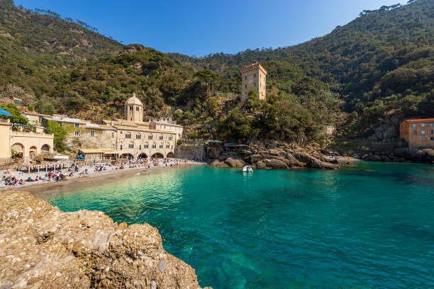 Beach of San Fruttuoso with the Ancient Abbey and the Doria Tower stock photo