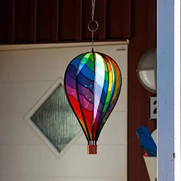 hot air balloon in rainbow colors as an ornament outside the door