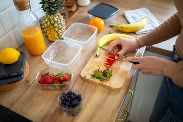 istock Woman preparing a tasty salad 1487455714