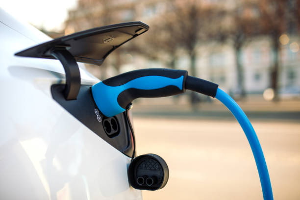 istock Electric car charging in public place 1487456217