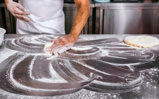 istock Baker uses the flour to make bread 1487456277