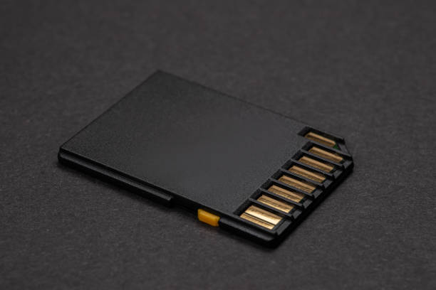 istock sd card lies on a dark background. close-up 1487456520