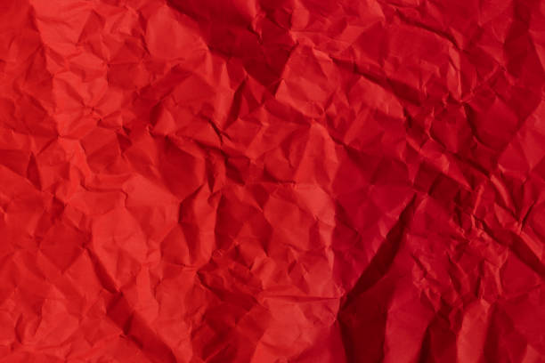 istock Red crumpled paper texture background. 1487456602