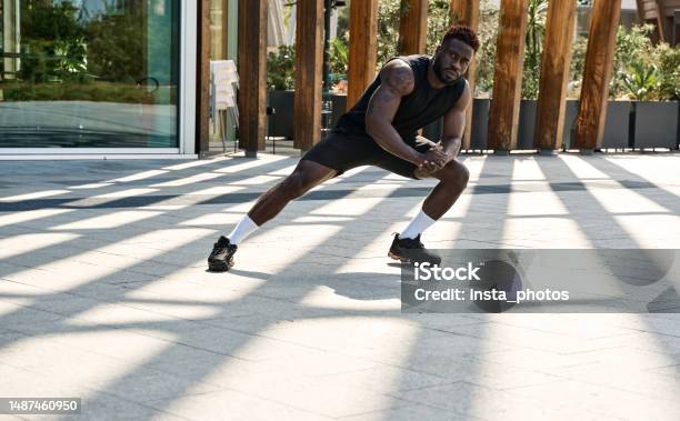 Fit Sporty Young Black Man Doing Warm Up Exercises In Workout Park Stock Photo - Download Image Now