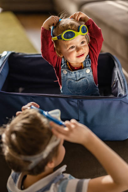 istock Cute children whit swimming goggles get ready for summer vacations 1487461002