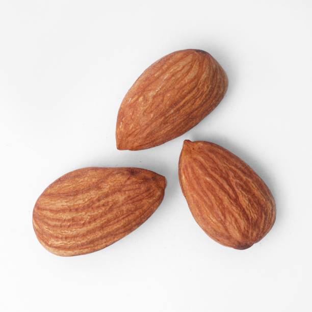 istock three almonds are on a white background, which is being taken 1487461931