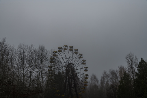 Ferris wheel in abandoned amusement park in ghost town Pripyat, Ukraine. Chornobyl exclusion zone
