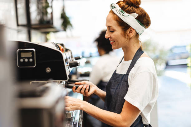 istock Barista brewing fresh coffee with a coffee machine 1487463564