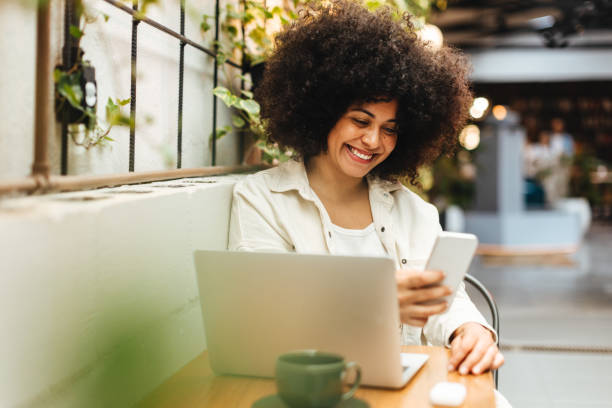 istock Woman using a phone to make a video call on her coffee break 1487463975