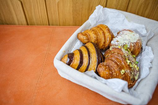 four types of croissants in basket