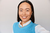Portrait, employee and Asian woman with happiness, selfie  and confident entrepreneur with startup. Mockup, female consultant or worker with a smile, social media or website launch for online profile