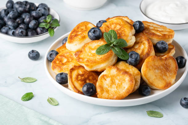 istock Homemade mini pancakes with blueberries 1487466979
