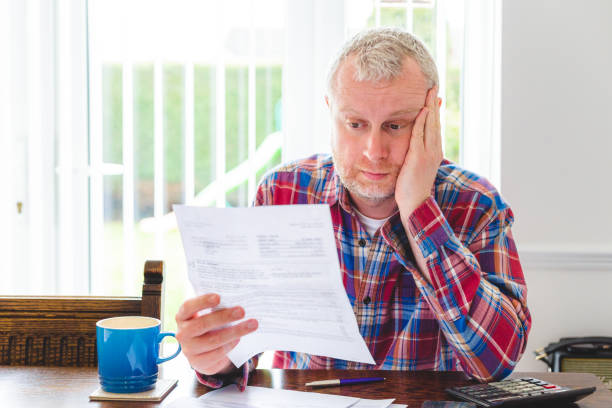 istock Worried man checking energy bills at home 1487467178