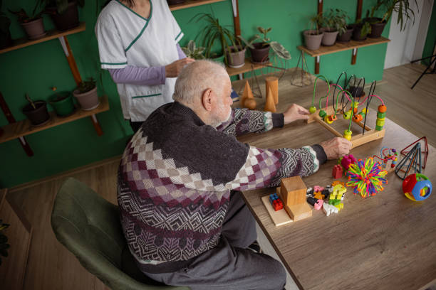 istock Toy therapy session helps senior man with dementia 1487468032